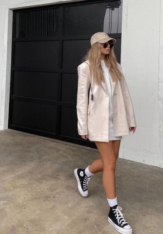 Pairing a blazer and dress creates a feminine look