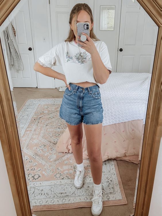 T-shirt and denim shorts with Reebok create a dynamic look