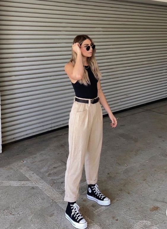 Pairing tank tops with straight pants creates a fashionable look